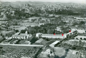 Aerial view of the asylum Saint-Paul-de-Mausole, near Saint-Rémy-de-Provence. A: the men's wing, with an arrow marking Van Gogh's cell; B. the north wing, where Van Gogh had his studio. Both wings had views of the large, overgrown garden with pine trees, another place where Van Gogh liked to work.